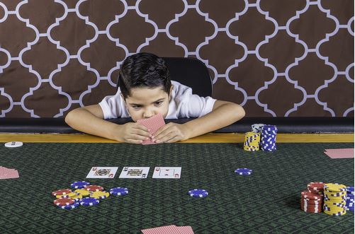 child playing poker