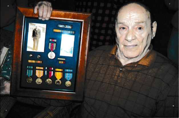 Frank Hoerst Jr. with Navy medals