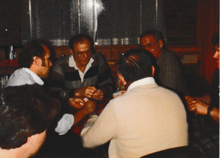 Frank Hoerst Jr. playing cards with family