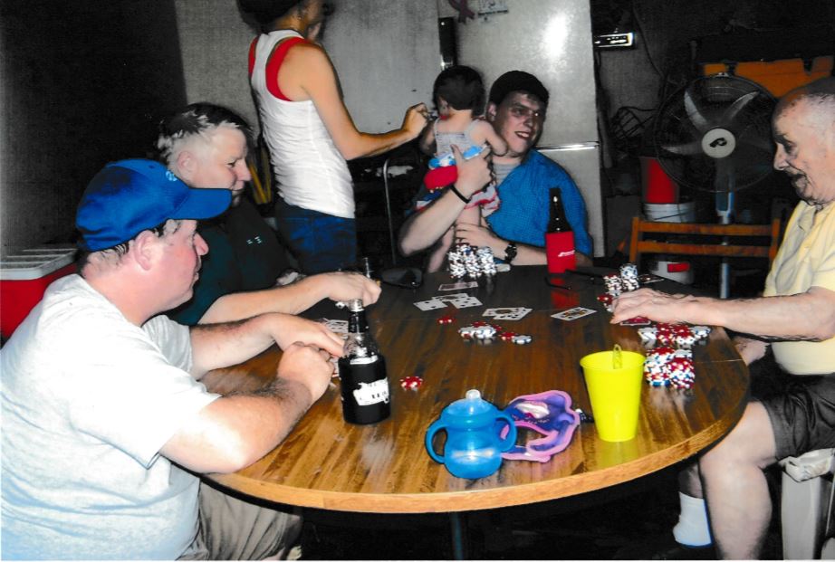 Frank Hoerst Jr. playing cards with family