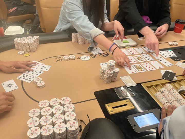 Players discuss a hand of Watermelon poker at showdown.