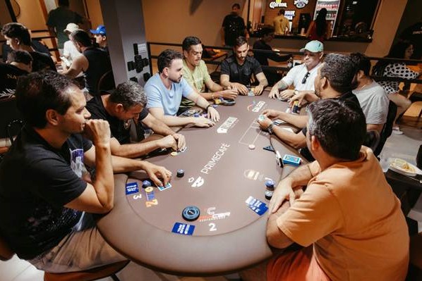 Players around poker table in position